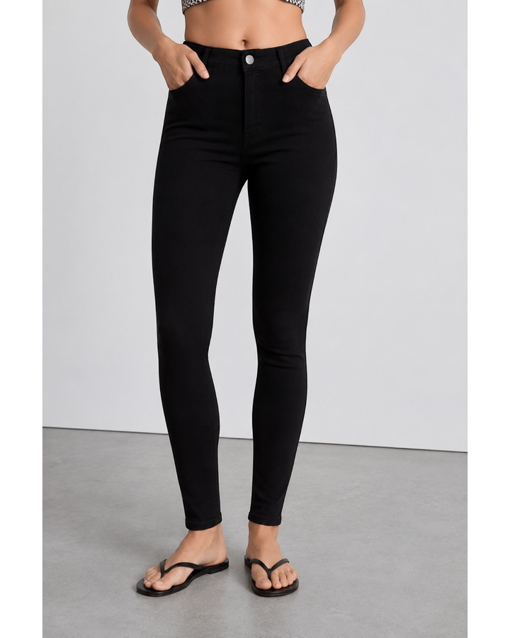 Luna Moda high-waisted black skinny jeans with a sculpting, stretchy fit worn by a model.