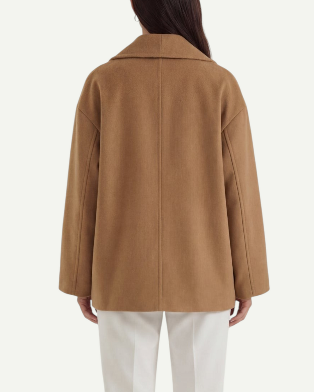 Back view of a woman wearing a Luna Moda camel oversized coat with clean lines and a relaxed fit.