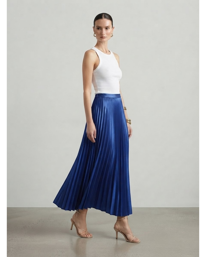 Luna Moda high-waisted royal blue pleated maxi skirt worn by a model with a white tank top and strappy heels