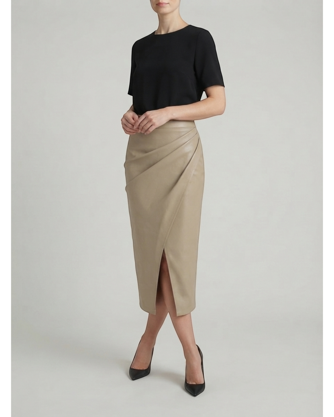 Luna Moda Natalie midi skirt in beige with draped detailing and a front slit, paired with a black top.