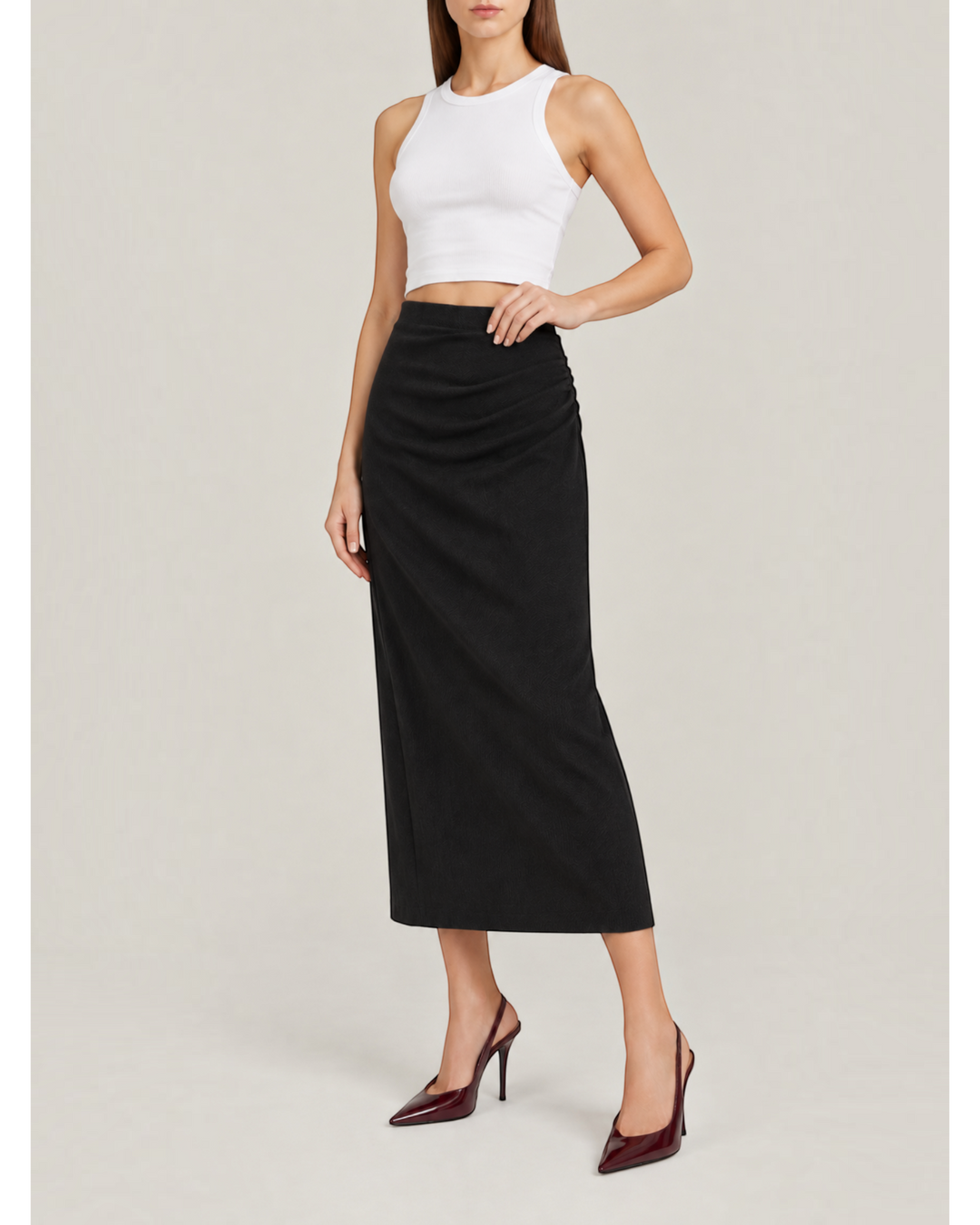 Luna Moda black midi skirt with side ruching in soft stretch cotton worn with a white crop top and heels