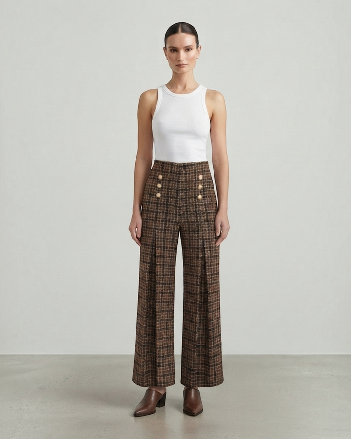 Luna Moda high-waisted palazzo trousers in brown plaid with gold button details, worn with a white tank top.