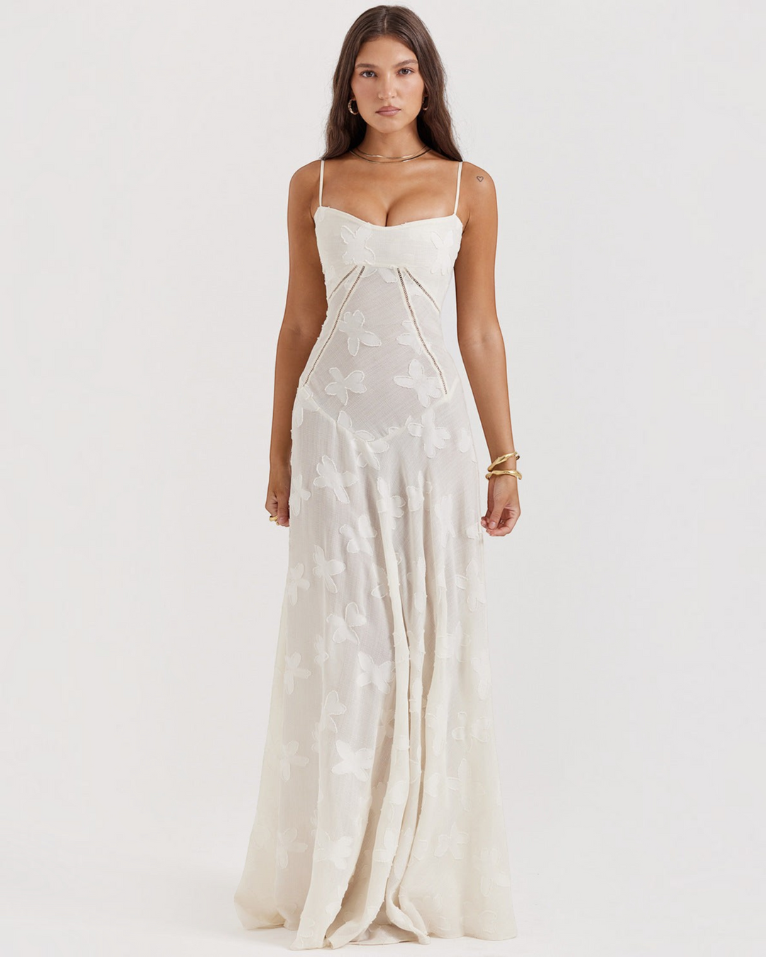 Luna Moda off-white floor-length dress with butterfly embroidery, sweetheart neckline, and thin adjustable straps.