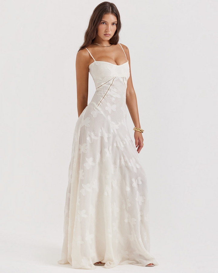 Luna Moda off-white floor-length dress with butterfly textures, sweetheart neckline, and spaghetti straps on a model