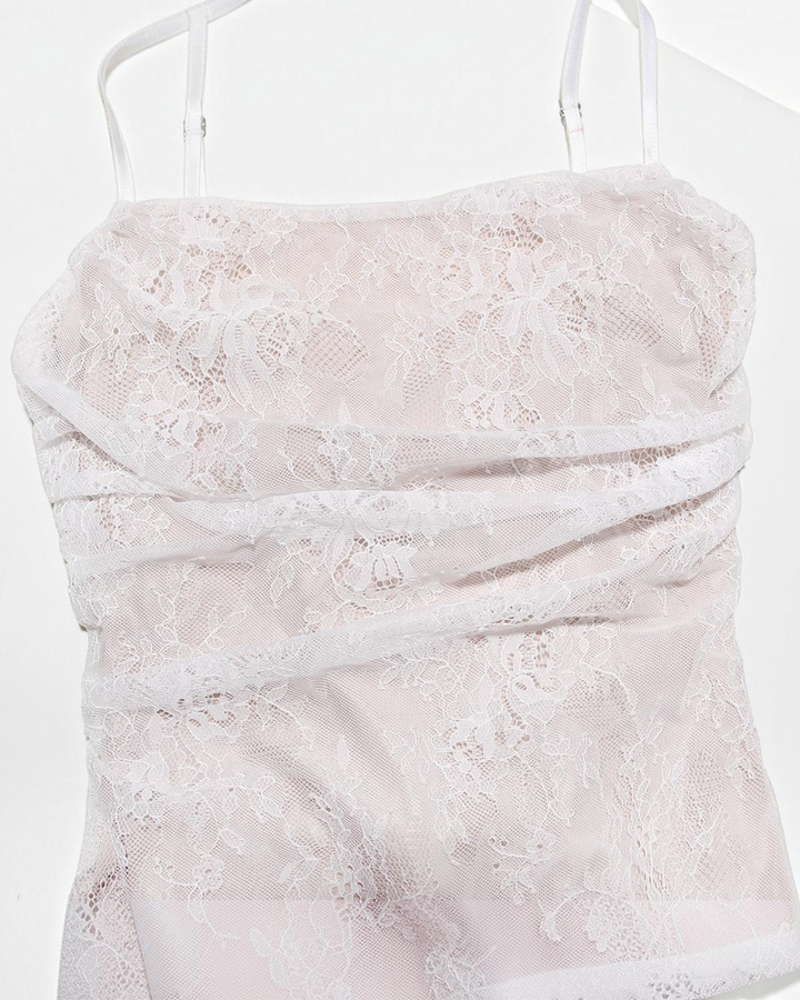 Luna Moda white lace maxi dress featuring a structured corset bodice with delicate floral patterns and spaghetti straps