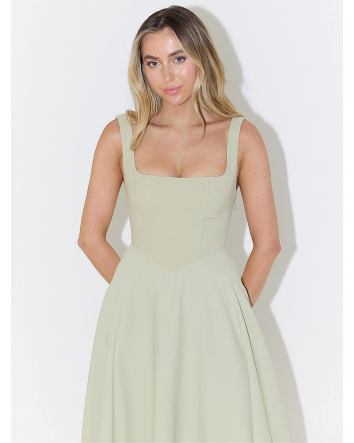 Luna Moda Scarlett Grace sage green midi dress with a square neckline and fitted bodice on a blonde model