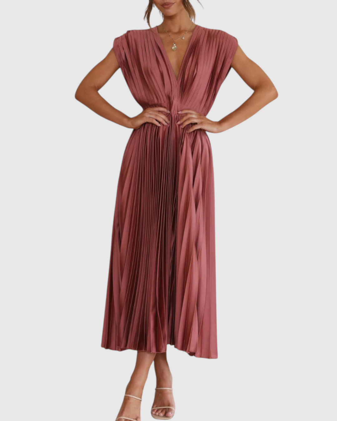 Luna Moda Isla pleated midi dress in rose red with a deep V-neck and high waist, worn by a model.
