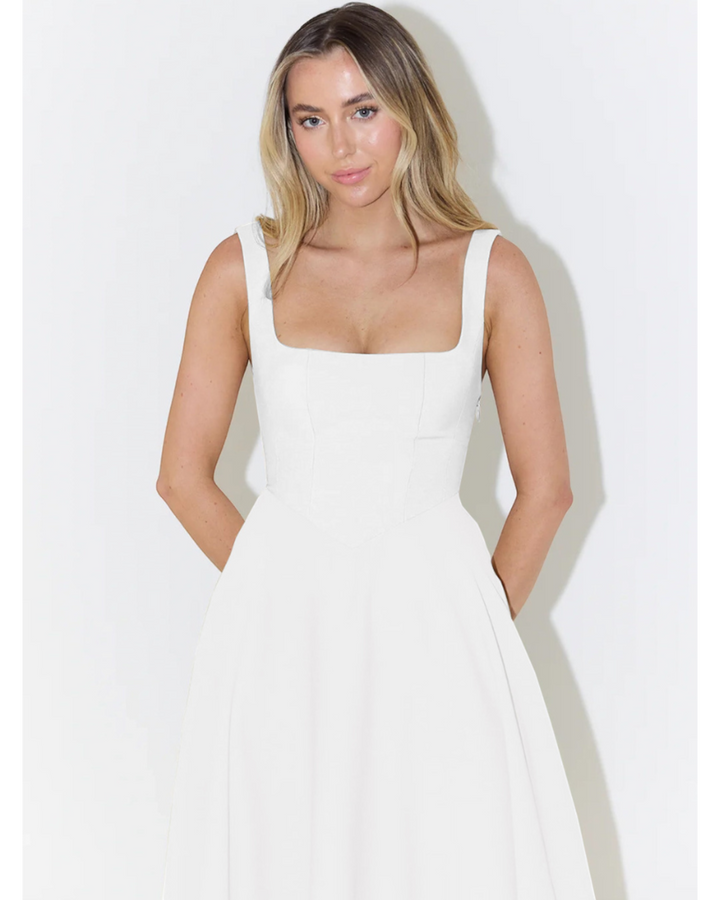 Luna Moda white Scarlett Grace dress with a square neckline and fitted bodice on a blonde model.