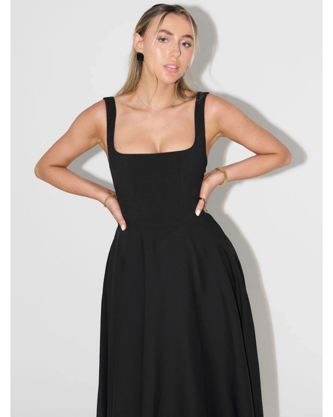 Luna Moda Scarlett Grace black midi dress with a square neckline and wide straps on a model