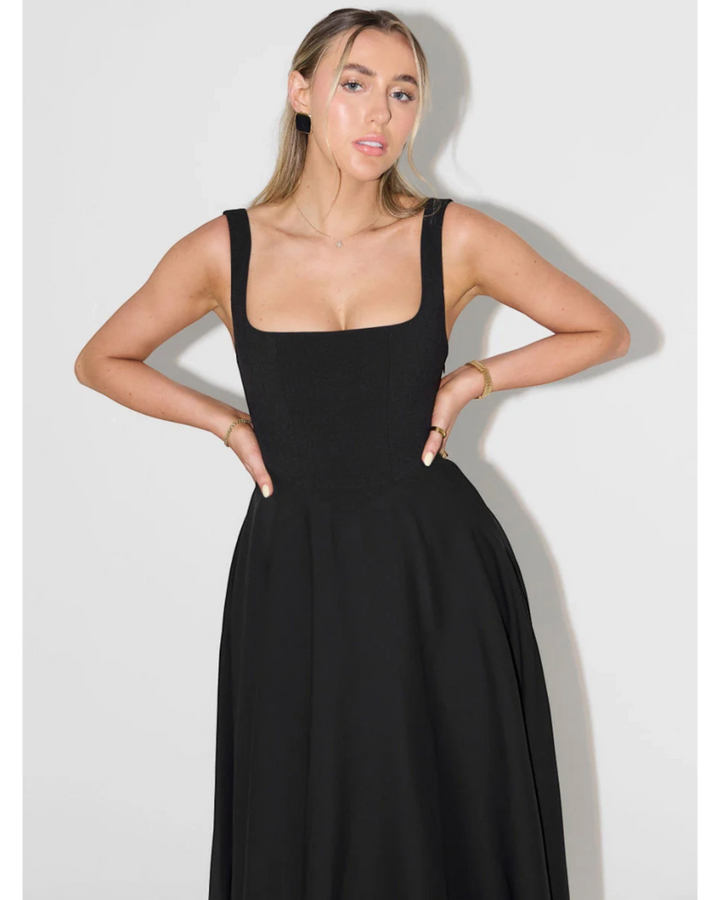 Luna Moda Scarlett Grace black midi dress with a square neckline and wide straps on a model