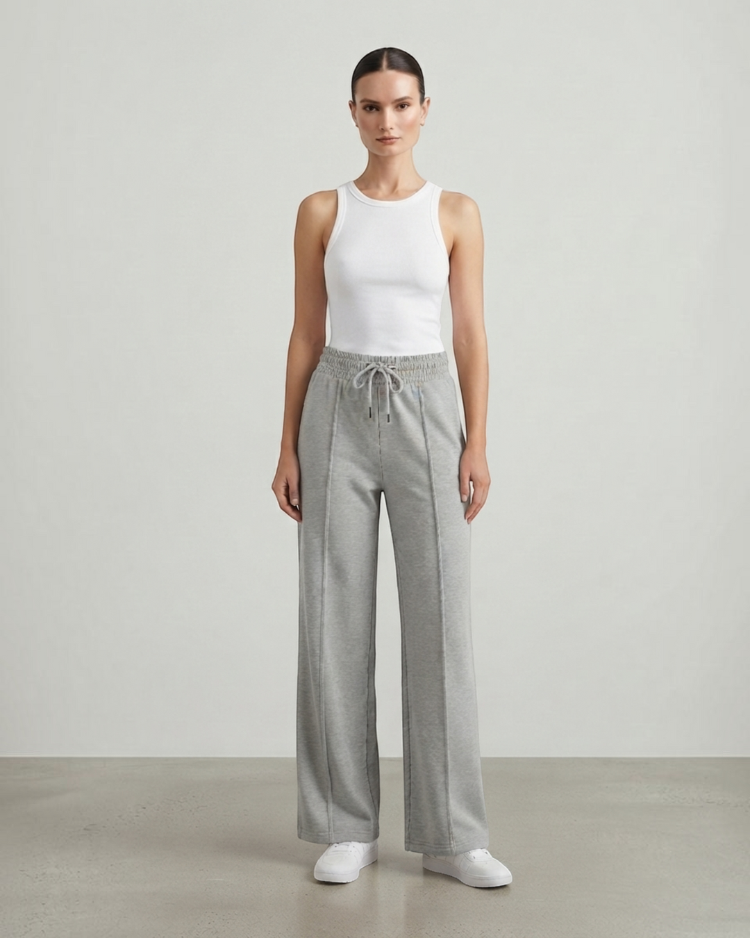 Luna Moda high-waisted grey wide-leg sweatpants with drawstring waist worn by a model with a white tank top