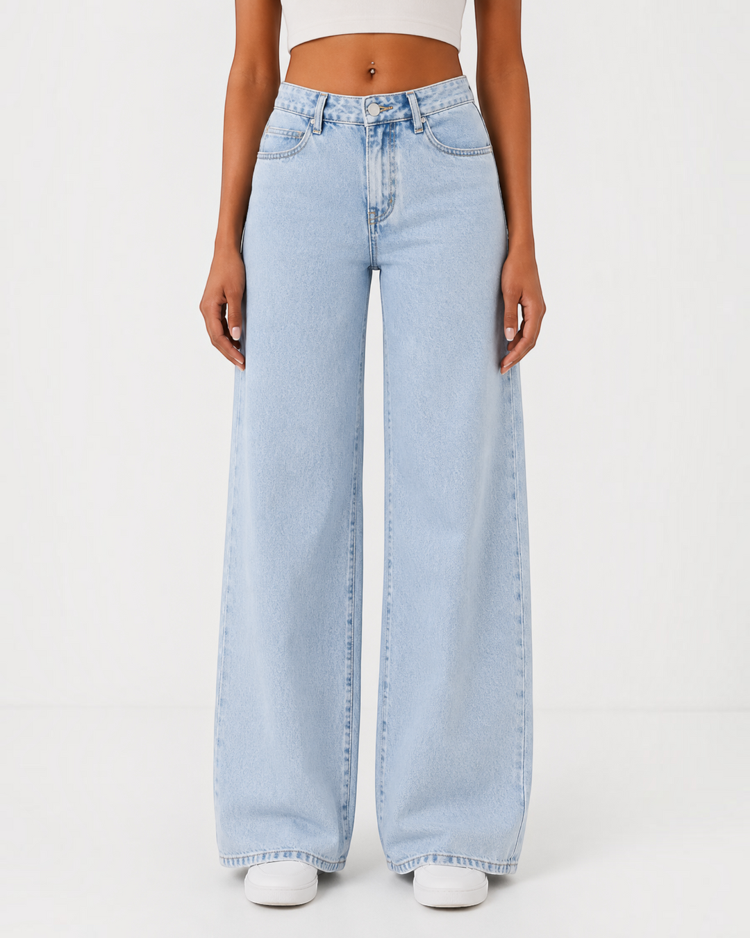 Luna Moda high-waisted wide-leg light wash denim jeans worn by a model with a white crop top and sneakers