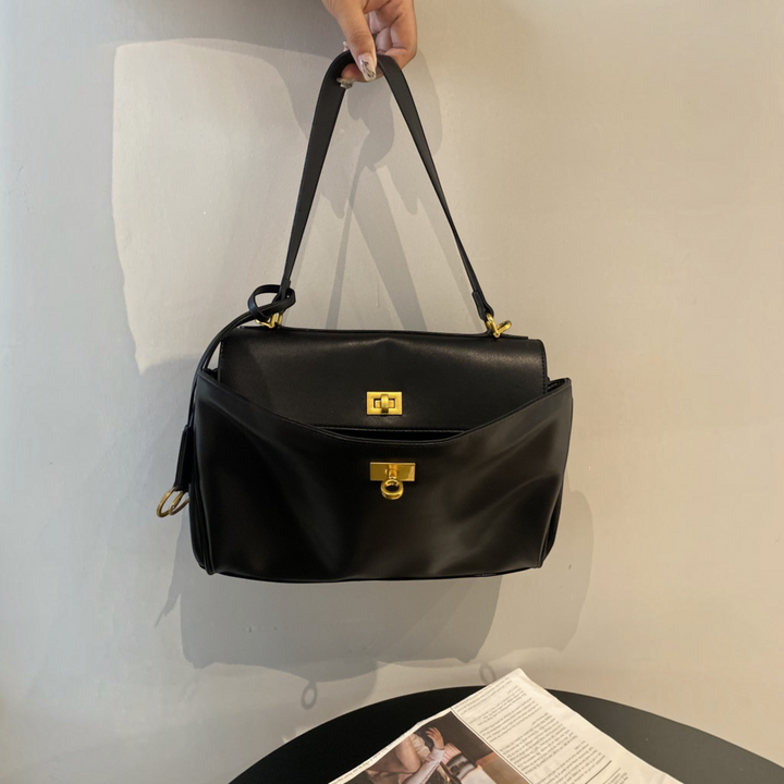 Luna Moda RAMONA black leather handbag with gold hardware, top handle, and structured flap closure.