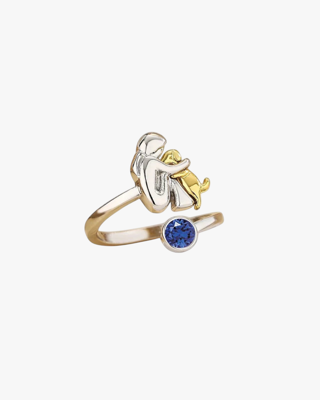 Luna Moda gold and silver dog hug ring featuring a blue crystal accent, symbolizing the bond between pet and owner.