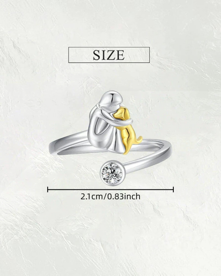 Luna Moda gold and silver dog hug ring with a clear crystal accent, symbolizing the bond between pet and owner.