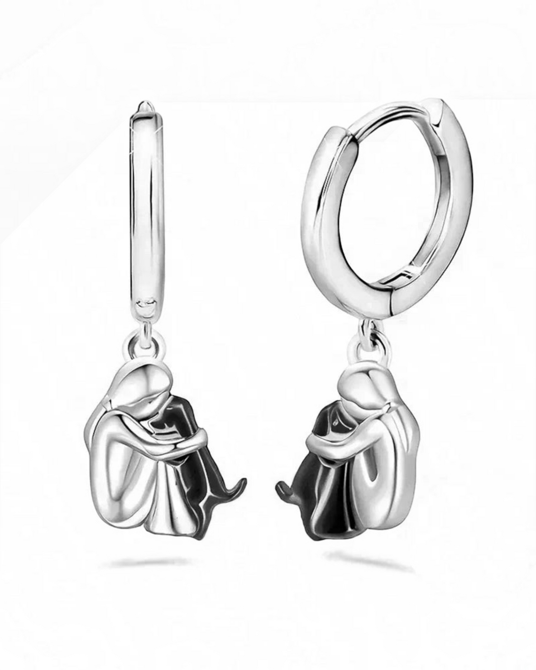 Luna Moda silver and gold-toned hoop earrings featuring a charming design of a person hugging their dog