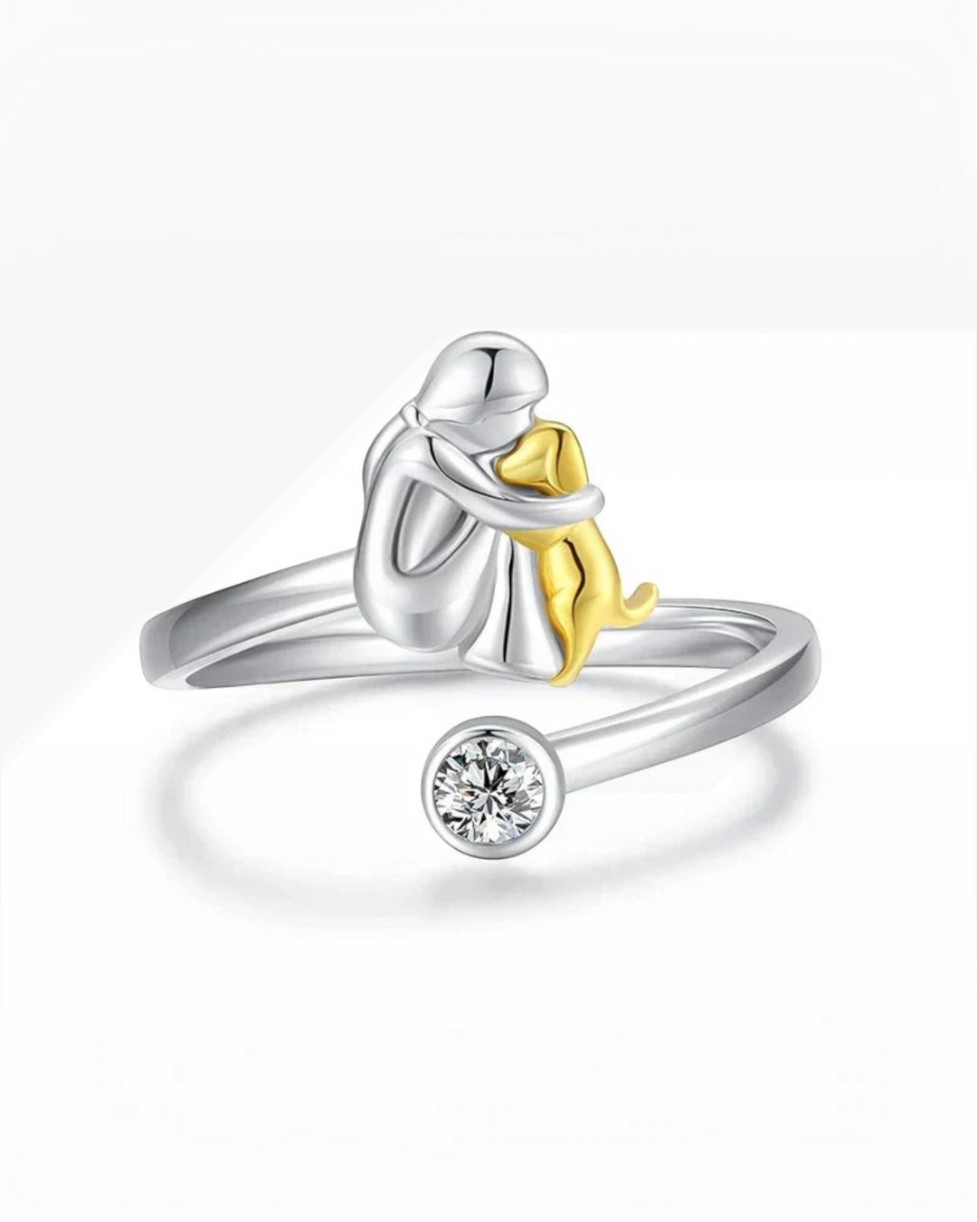 Luna Moda silver ring featuring a person hugging a gold dog with a sparkling crystal accent