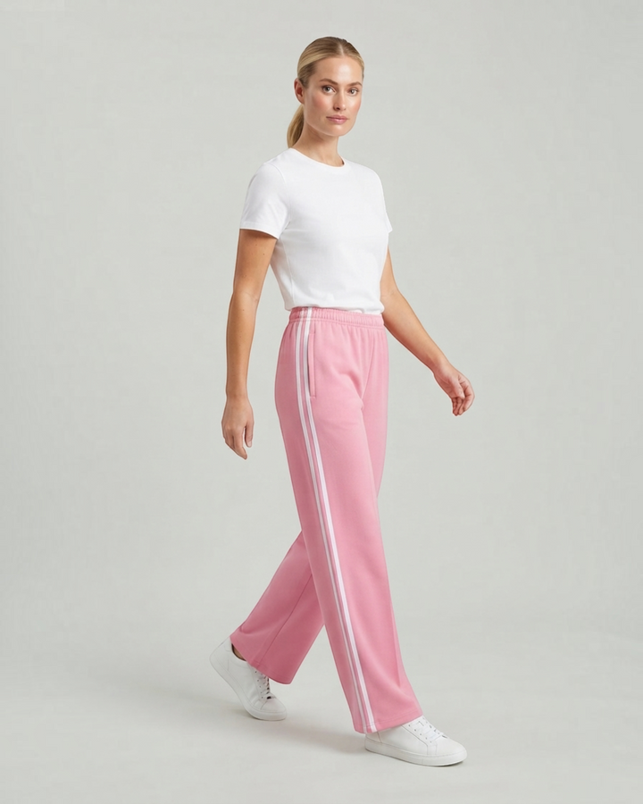 Luna Moda pink wide-leg sweatpants with white side stripes and drawstring waist worn by a woman with a white t-shirt