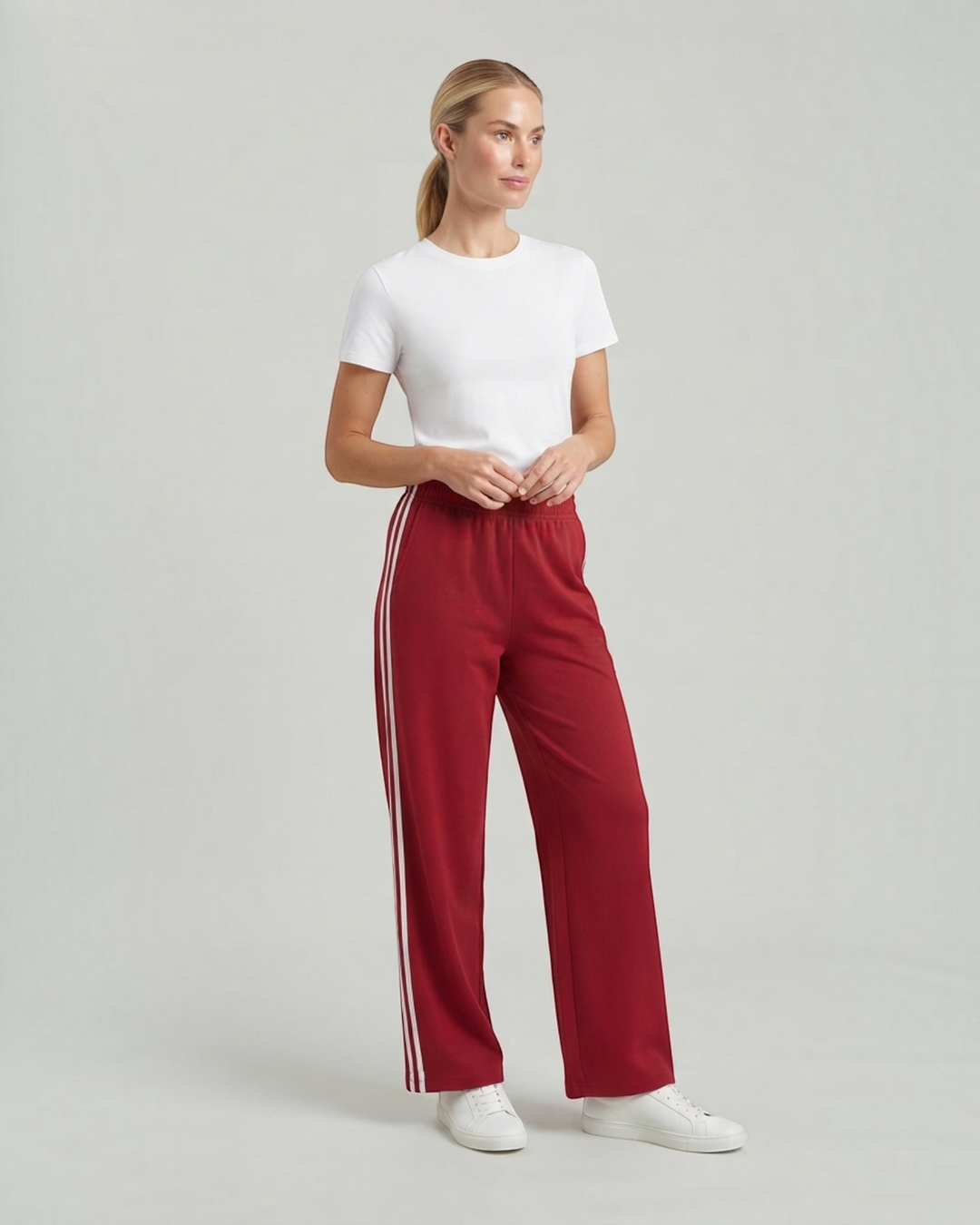 Luna Moda wide-leg red track pants with white side stripes and drawstring waist worn by a woman with a white t-shirt