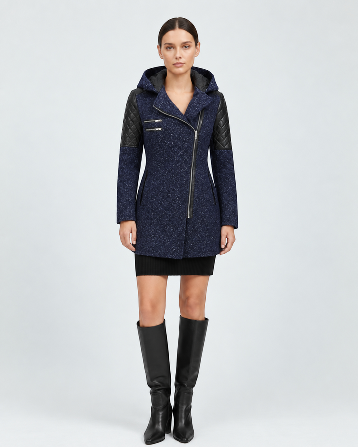 Luna Moda Sibilla winter jacket in navy blue with an asymmetric zip, quilted leather sleeves, and a hood.