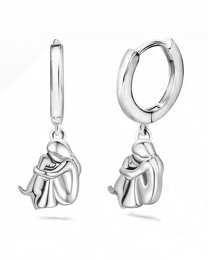 Luna Moda silver and gold tone hoop earrings featuring a charming dog hug pendant for a sentimental style.
