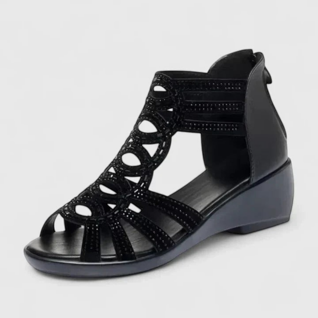 Luna Moda Mariana black orthopedic wedge sandals with decorative circular cutouts and rhinestone embellishments