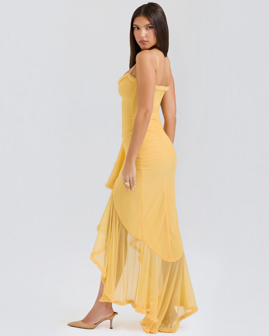 Luna Moda Edith yellow midi dress with thin straps, ruched bodice, and a high-low ruffled hem on a model.