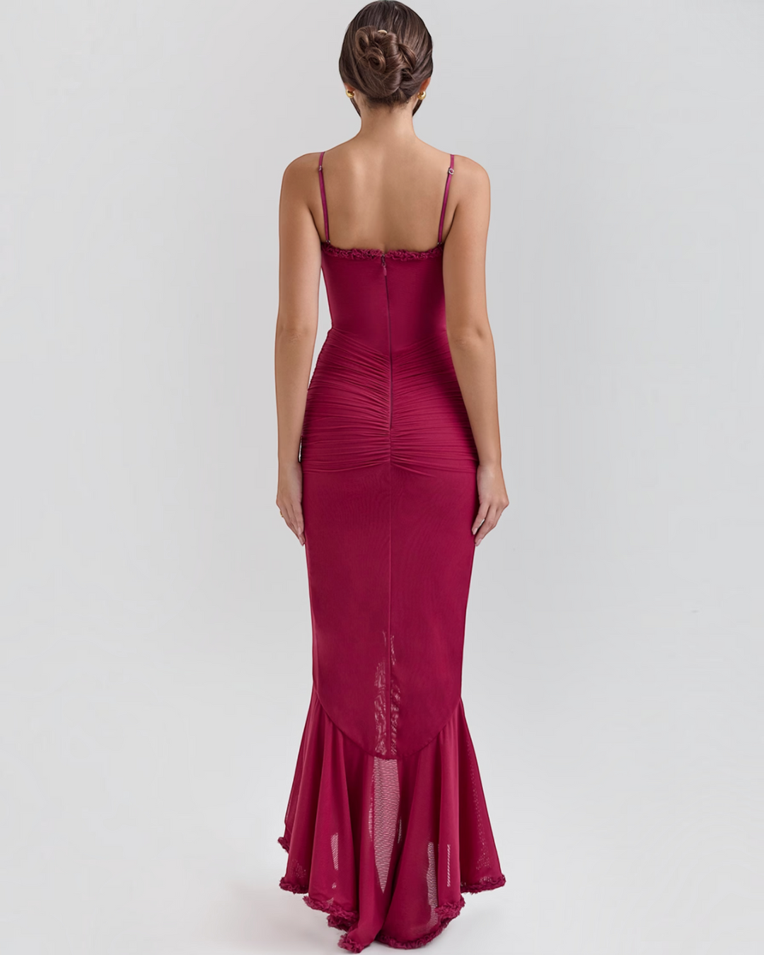 Luna Moda Edith burgundy midi dress with spaghetti straps, ruched back detail, and a ruffled hem on a model.