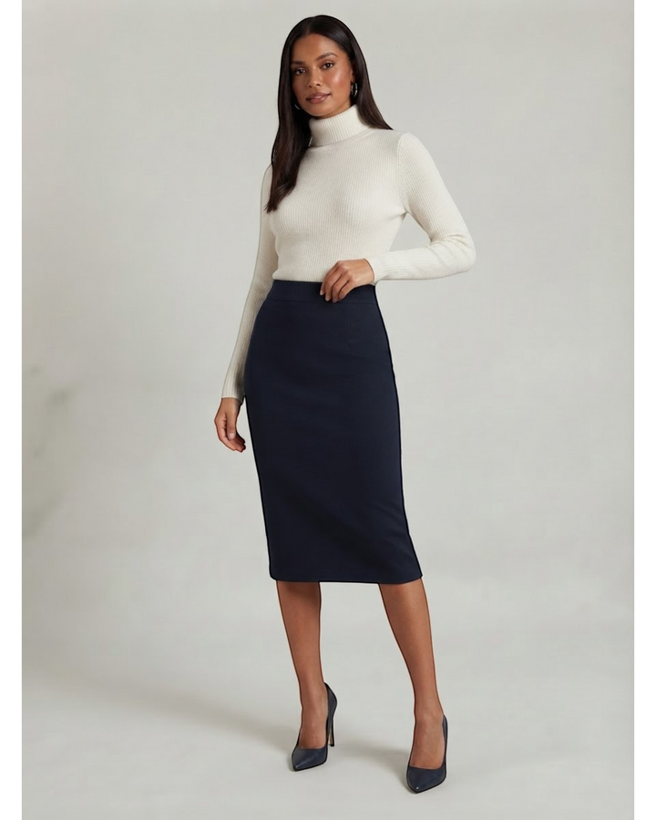 Luna Moda high-waisted navy blue structured midi skirt worn by a model with a cream turtleneck and heels