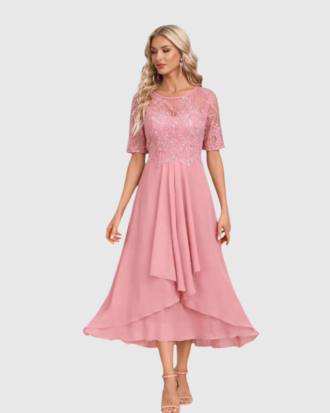 Luna Moda midi dress in dusty pink lace with short sleeves and a flowing skirt worn by a blonde model
