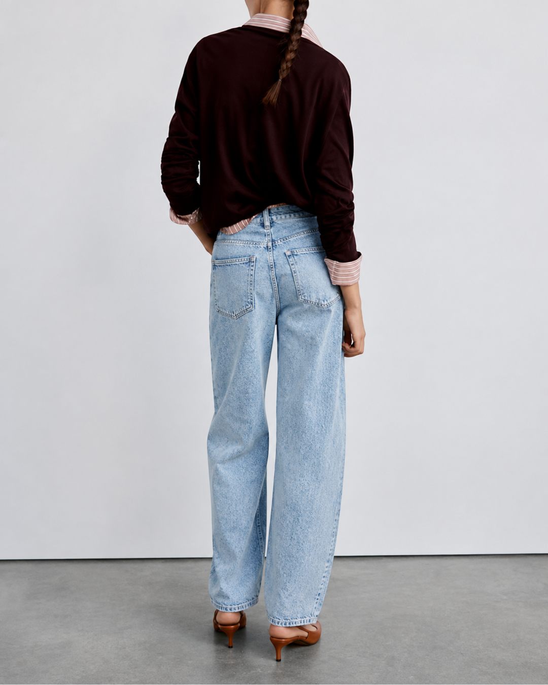 Luna Moda high-waisted baggy jeans in light vintage wash denim, back view on a model wearing a dark sweater.