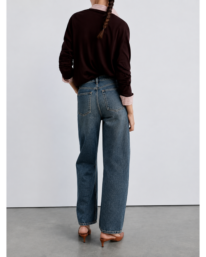 Luna Moda high-waisted baggy jeans in vintage washed blue denim with a relaxed wide-leg fit, back view.