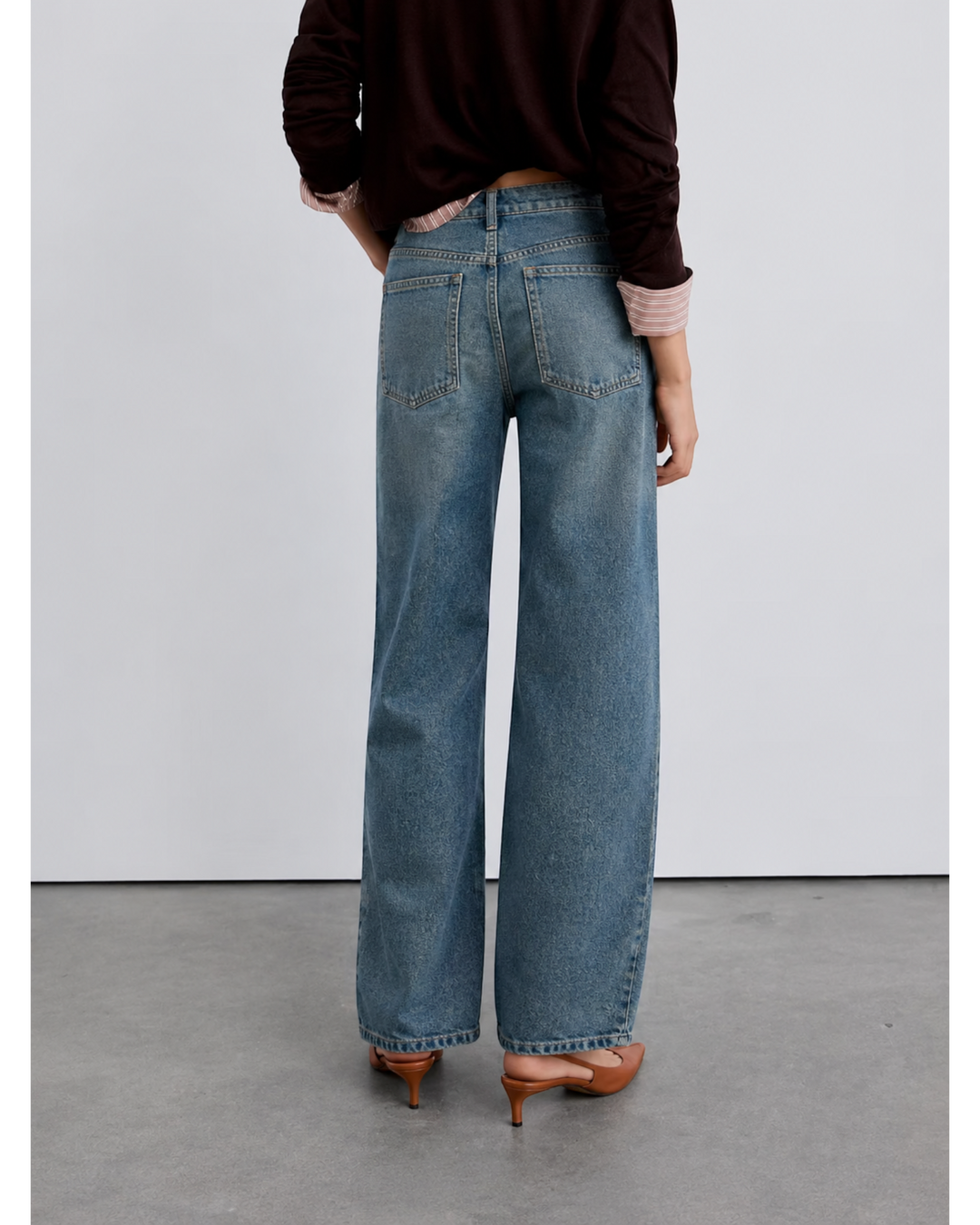 Luna Moda high-waisted baggy jeans in vintage washed blue denim, captured from a rear view on a model.
