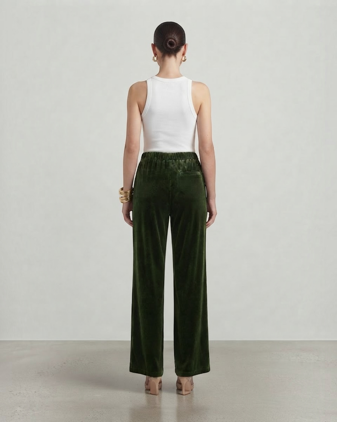 Luna Moda Viviana wide-leg velvet trousers in dark green, shown from the back with a white tank top.