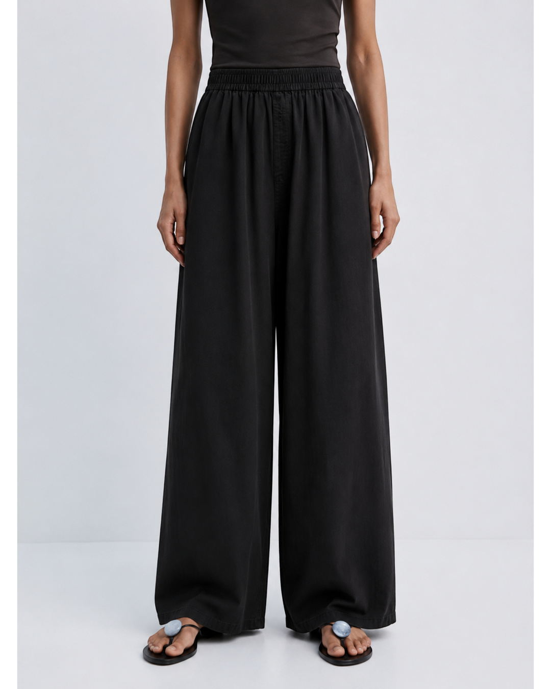 Luna Moda ZINNA high-waisted black palazzo pants with a relaxed wide-leg fit on a model