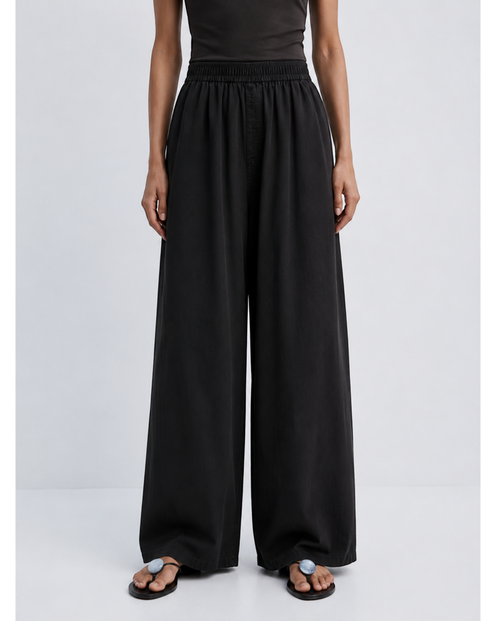 Luna Moda ZINNA high-waisted black palazzo pants with a relaxed wide-leg fit on a model