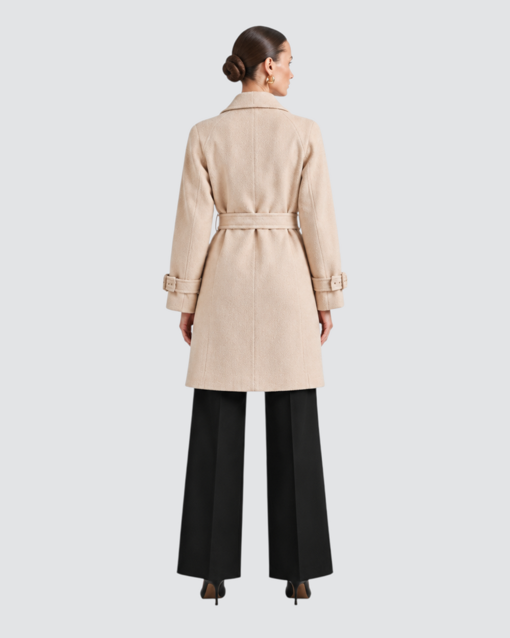 Luna Moda beige trench coat with belted waist and cuffs, worn by a model from the back view.