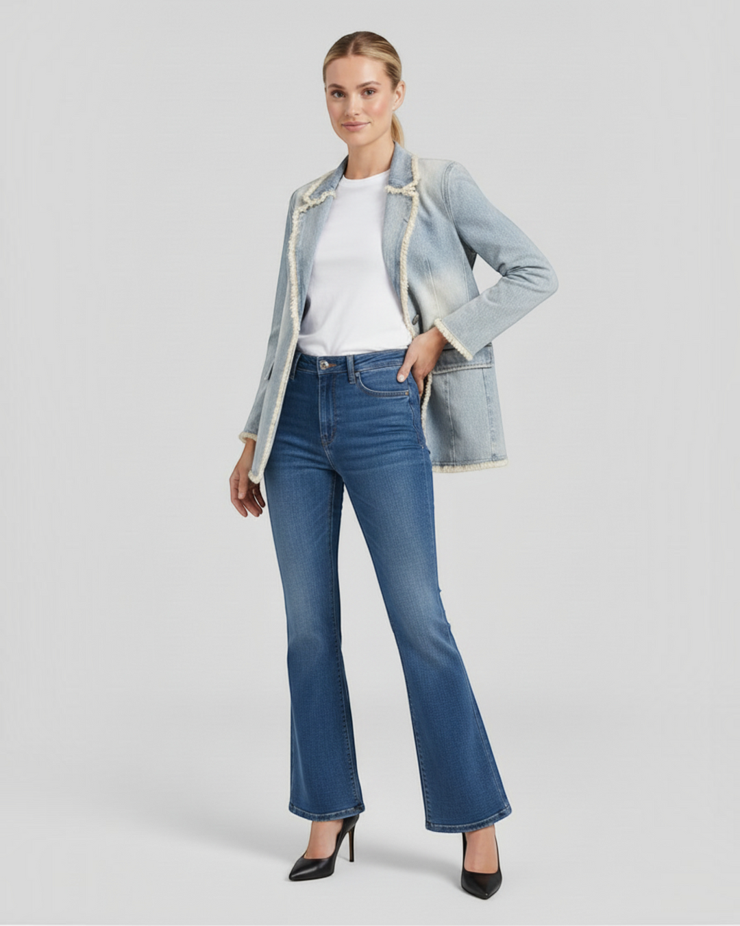 Luna Moda Anna light blue washed oversize blazer with frayed edges, worn by a model with jeans and heels.