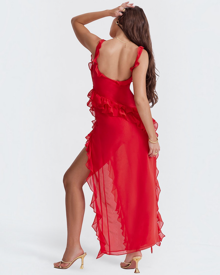 Luna Moda red sleeveless maxi dress with ruffles and a high leg slit worn by a model against a white background