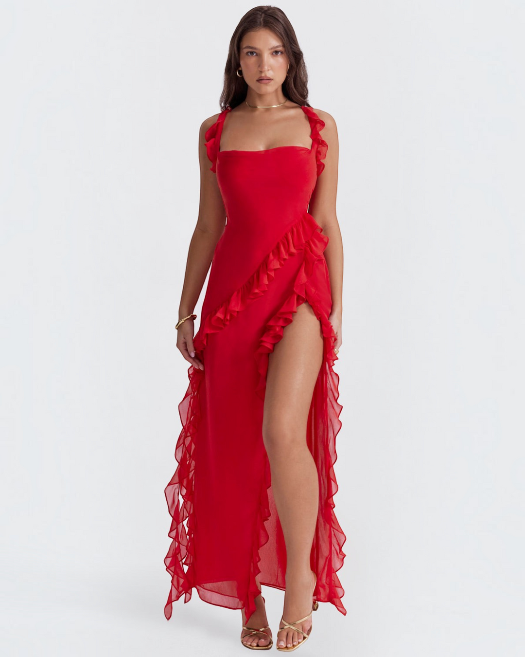 Luna Moda Andrea red maxi dress with ruffled trim and a high side slit worn by a model on a white background