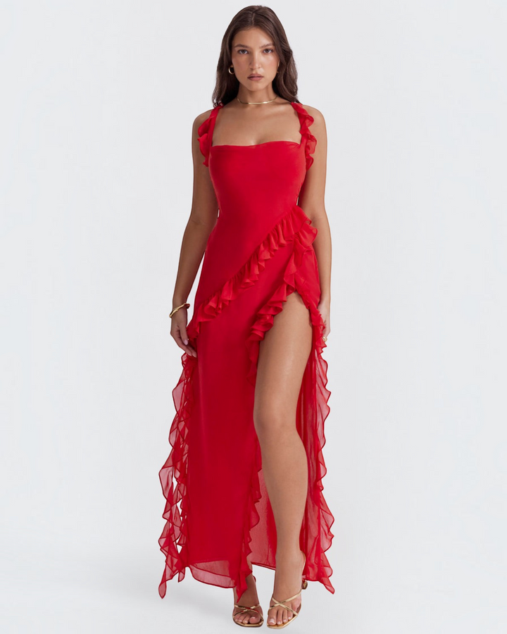 Luna Moda Andrea red maxi dress with ruffled trim and a high side slit worn by a model on a white background
