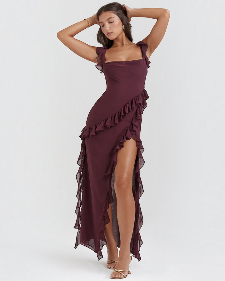 Luna Moda Andrea burgundy maxi dress with ruffled trim, square neckline, and high leg slit worn by a model