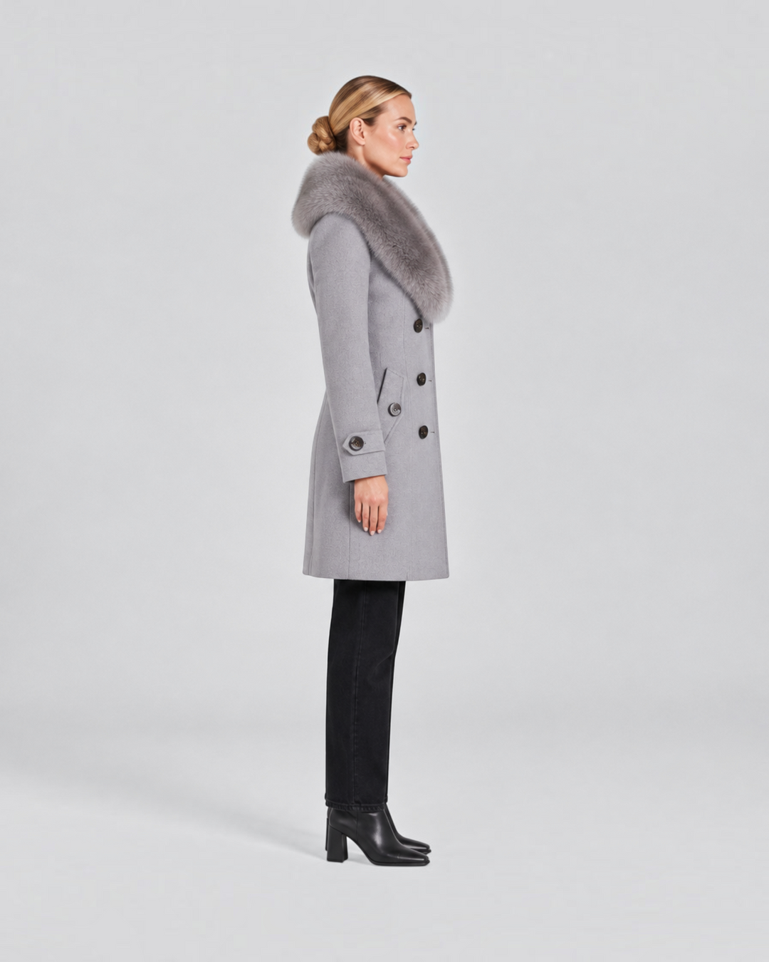 Luna Moda grey tailored short coat with a plush faux fur collar worn by a woman in profile view