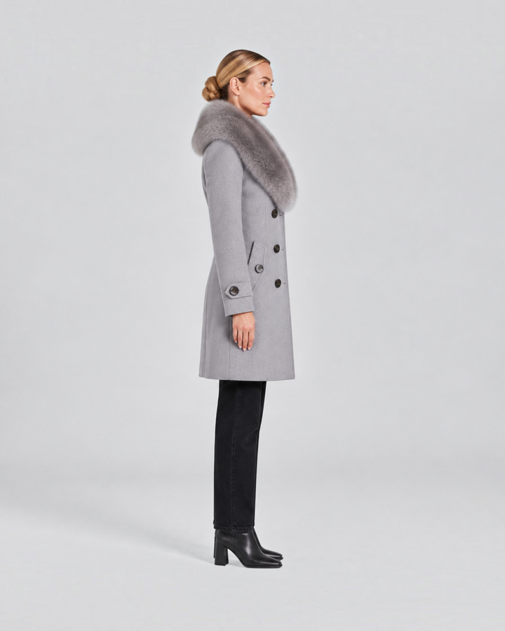 Luna Moda grey tailored short coat with a plush faux fur collar worn by a woman in profile view