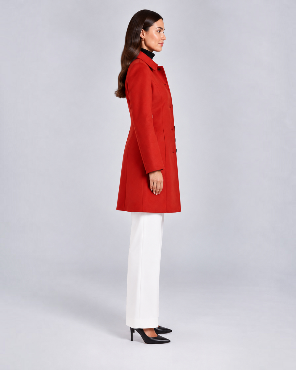 Luna Moda red fit and flare coat with a classic collar and button closure worn by a model in profile view.