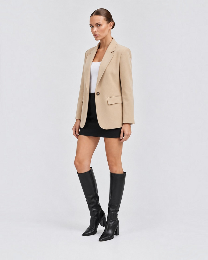 Luna Moda Margarida beige premium blazer worn by a model with a white top, black mini skirt, and black knee-high boots