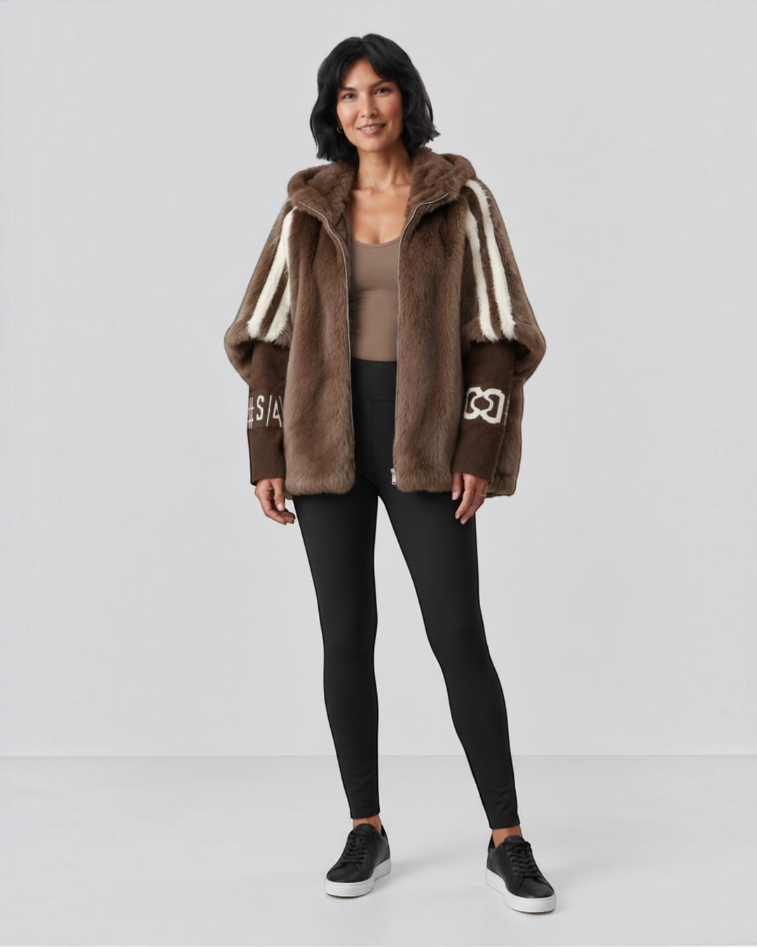 Luna Moda Carolina hooded jacket in brown faux fur with white striped shoulder details and ribbed sleeve cuffs.