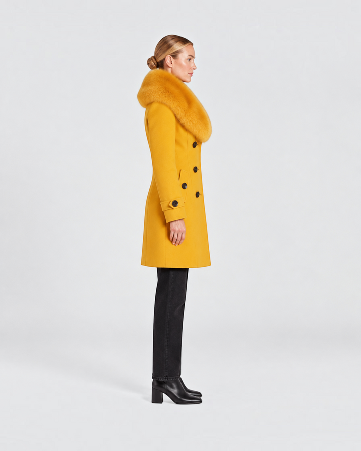 Luna Moda yellow short tailored winter coat with a faux fur collar worn by a model in a side profile view.