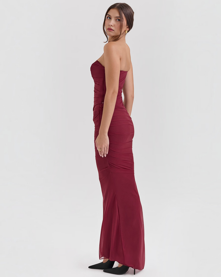 Luna Moda Seraphina burgundy mesh corset dress with draped bodice and boning, worn by a model in a studio.