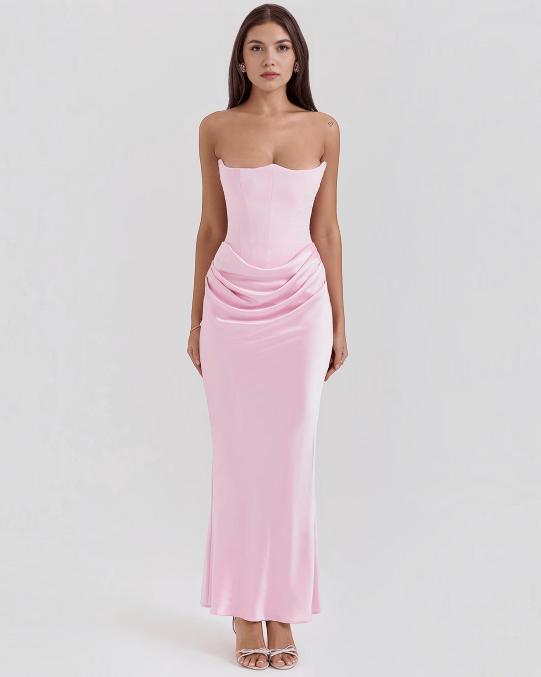 Luna Moda strapless light pink satin maxi dress with a corset bodice and draped waist detail on a female model